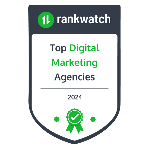 Award badge with a shield shape, displaying the Rankwatch logo. Text reads "Top Digital Marketing Agencies 2024" with a green ribbon icon at the bottom.